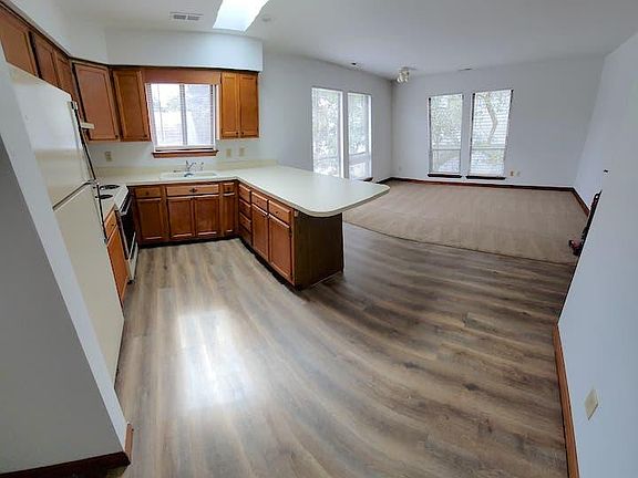 New flooring and greatroom carpet. New blinds.