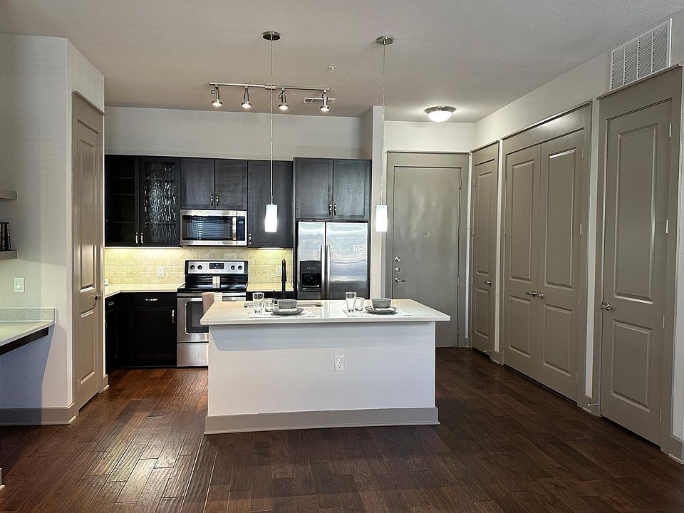 10ft ceilings and hand-scraped hardwood floors.