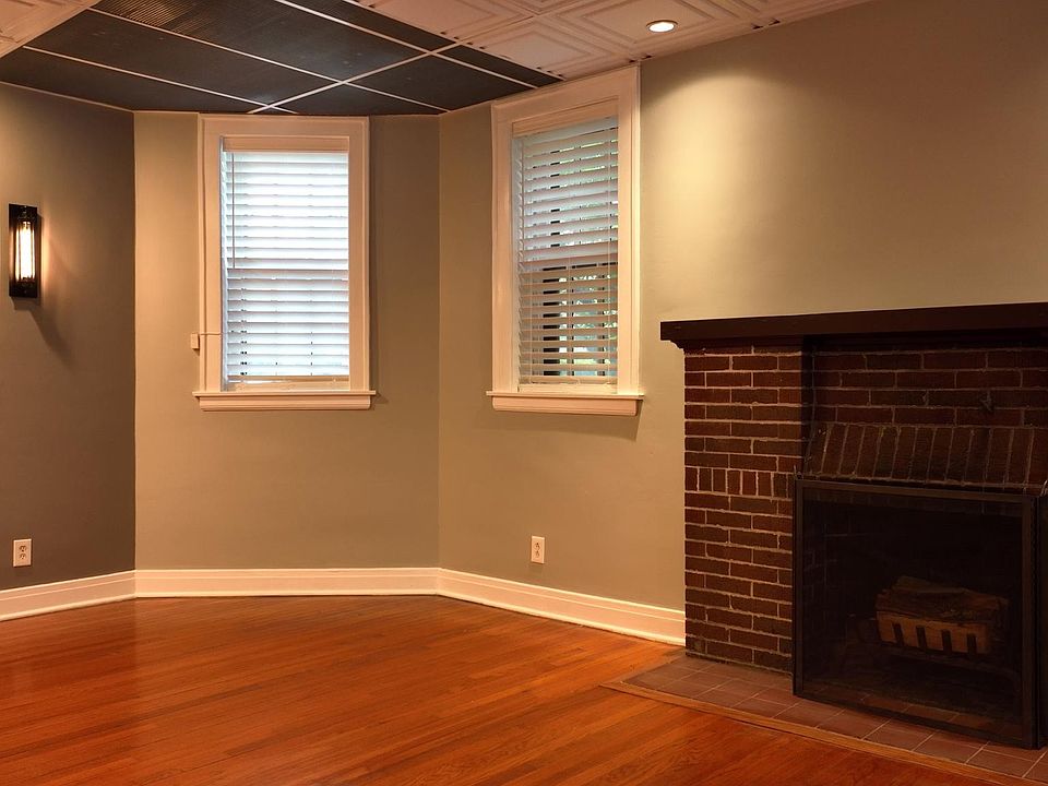 Living Room/Dining Room:: Enormous Space, Wood Burning Fireplace, Private Entrance, Wall Sconces & Light Fixtures, New Electrical Throughout, Window Treatments