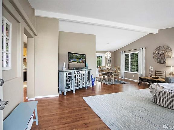 An updated interior featuring new paint and custom wood blinds.