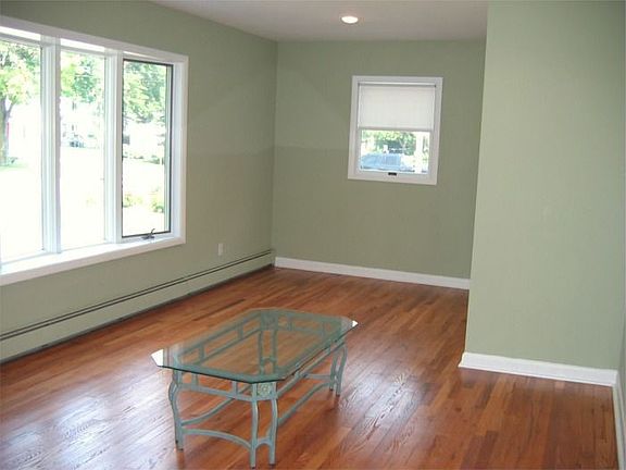 Living Room/Dining Room w/gleaming refinished hardwood flooring