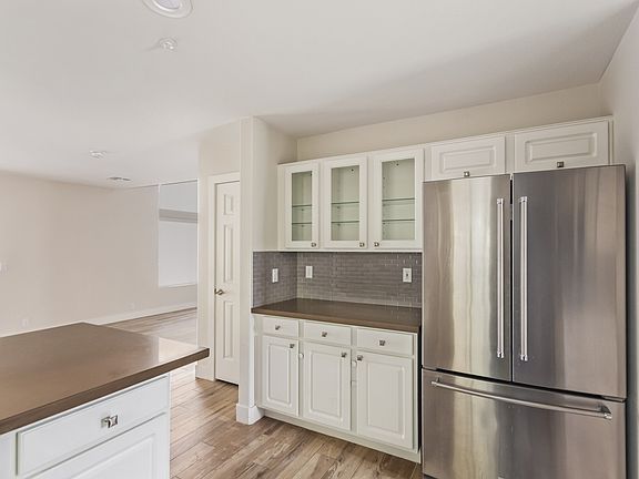Kitchen with lots of cabinets.