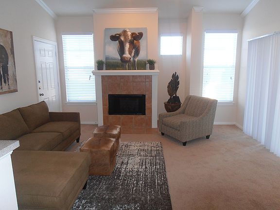 Living room with wood burning fireplace