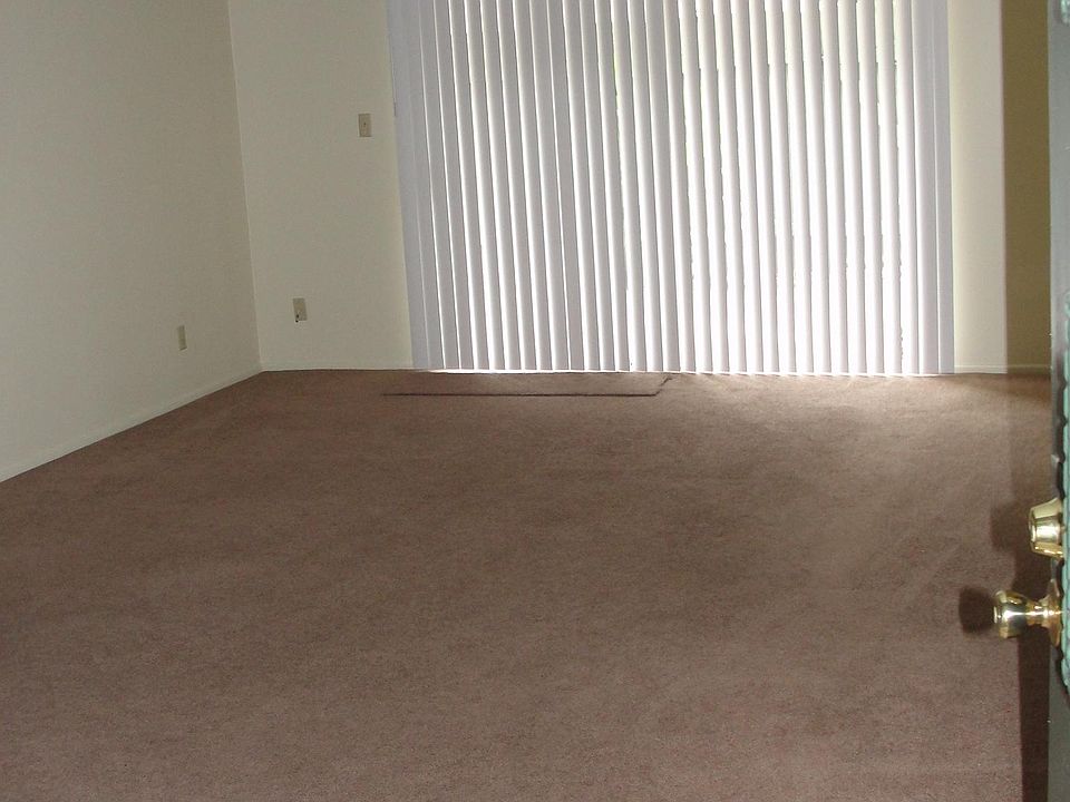 Living room. 17' x 14' 4" Large sliding glass doors to patio.