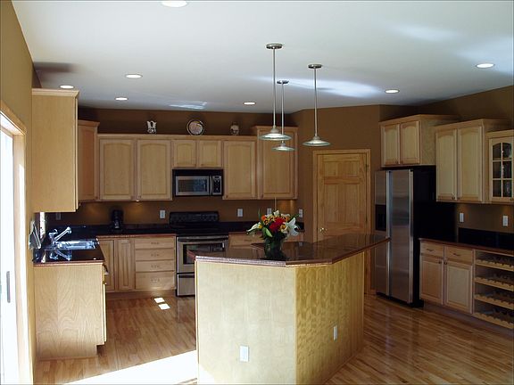 Kitchen - maple cabinets and a walk-in pantry provide ample storage space