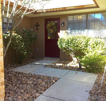 Front Entryway
						:
						Has a burgundy door and bull rock landscaping.