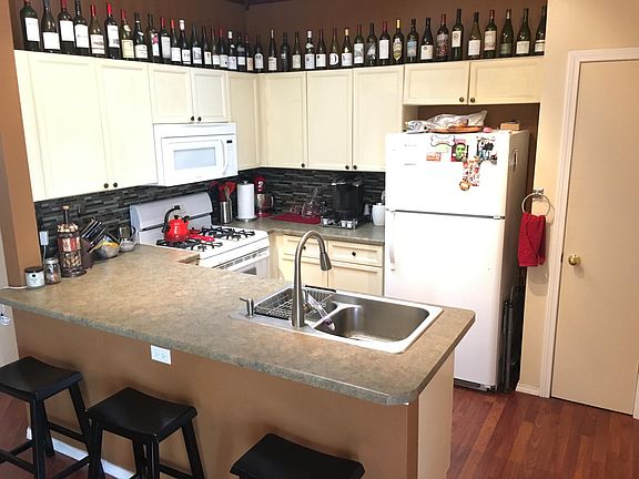 Kitchen will fridge, stove, microwave, and dishwasher. 