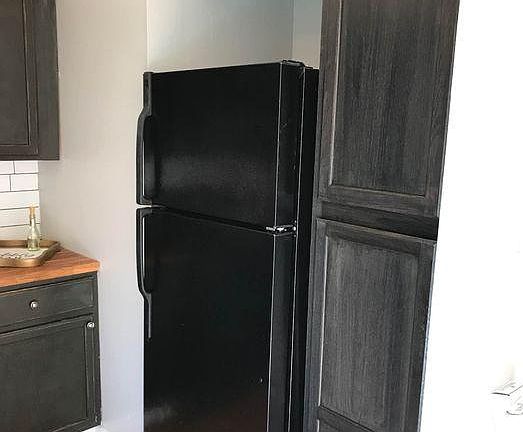 Full size refrigerator. Floor to ceiling pantry.