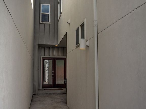 Well lit private entry with French door full-light door.