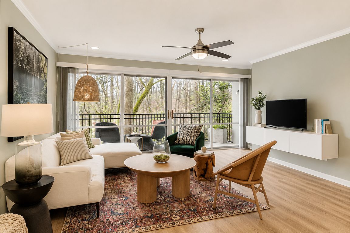 Relax in bright apartment living spaces with views of lush greenery.