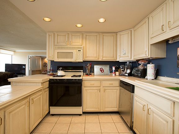 Kitchen has plenty of cabinets and counter space.
