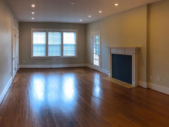 Recessed lighting and beautiful hardwood floors