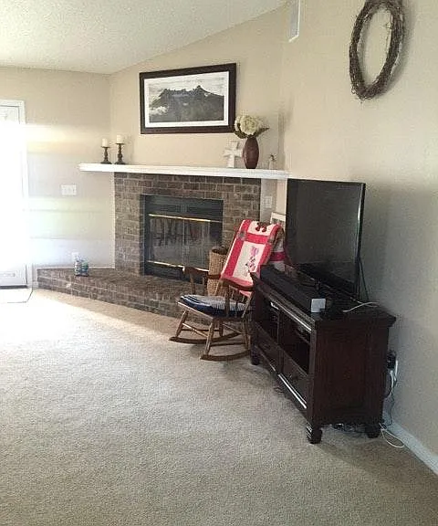 Living Room w/ wood buring fireplace