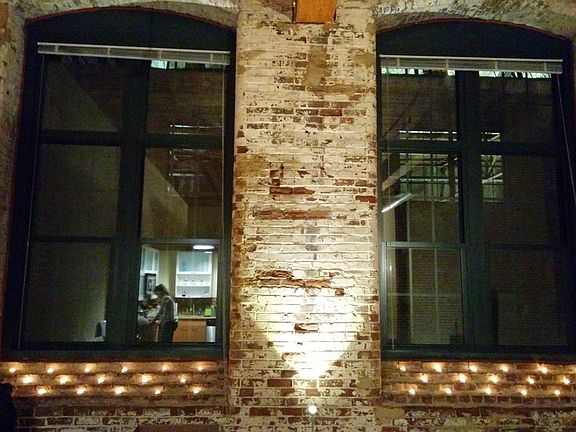 Exposed brick with candle light
