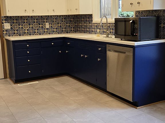 Newly remodeled kitchen with updated lighting, flooring and appliances.