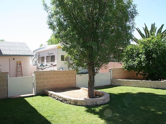 South side of lot has RV parking separated by interior brick walls and gates. 