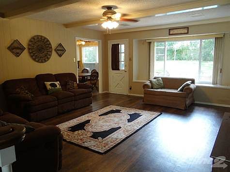 Large open living area overlooks pool