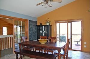 Dining Room with Patio Doors to Deck and Waterfall