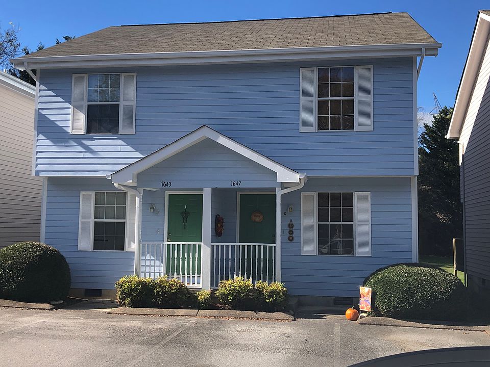 The townhome is currently being painted Grey with Black Shutters.