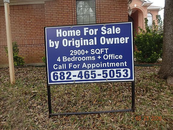 For Sale Sign in Front Yard