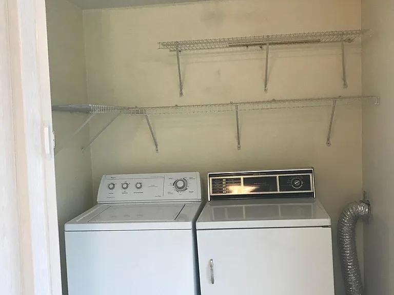 Laundry room w/ washer and dryer in unit.