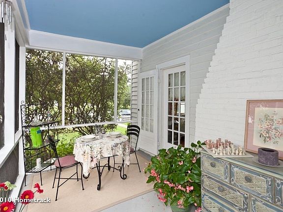 Cozy sun porch perfect for reading and dining
