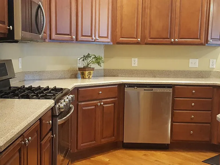 Kitchen. Stainless steel appliances, including gas stove, microwave and dishwasher