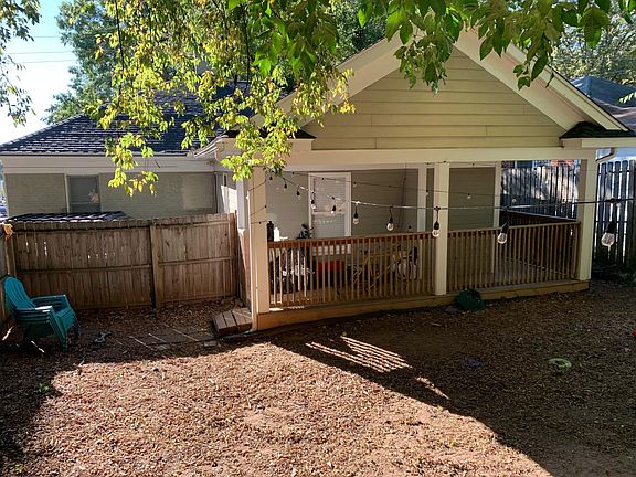 This is a view of the fenced in back yard and back porch.