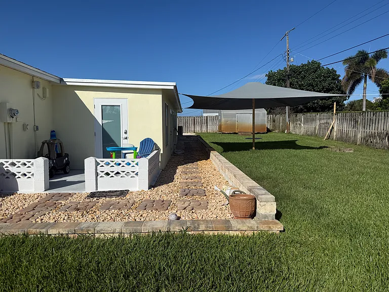 Side patio/entrance to guest/playroom