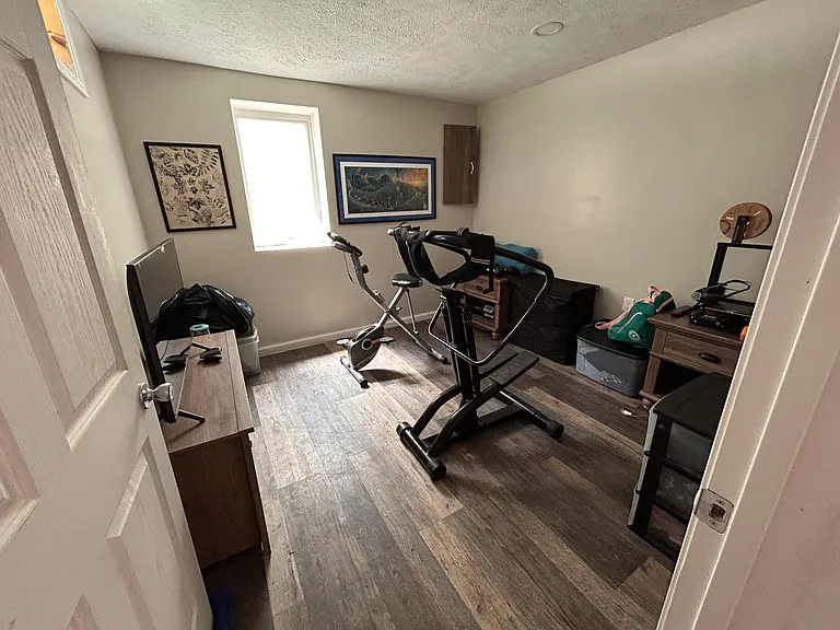 Basement bedroom/exercise room w/ egress window.