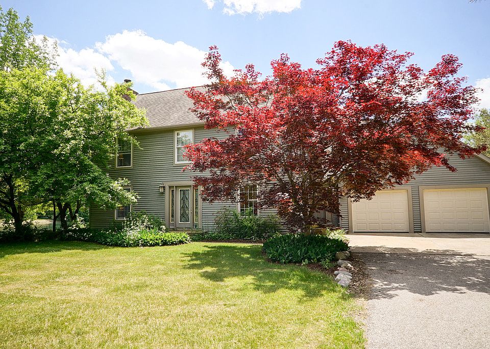 Just 10 minutes from Main Street is this absolutely stunning hidden gem of a home on a private lake.  Located in the Grand Lake Estates Association, this 4 bedroom, 4 bath, 3458 square foot beauty is perfectly positioned on 2.8 acres.  The updated cherry kitchen opens to the 2004 addition of a family room and loft area with its 2-story wall of windows overlooking the water. Multiple decks, three living areas, a main floor den, outbuilding and a new Harman pellet stove and water treatment system round out this wonderful property.