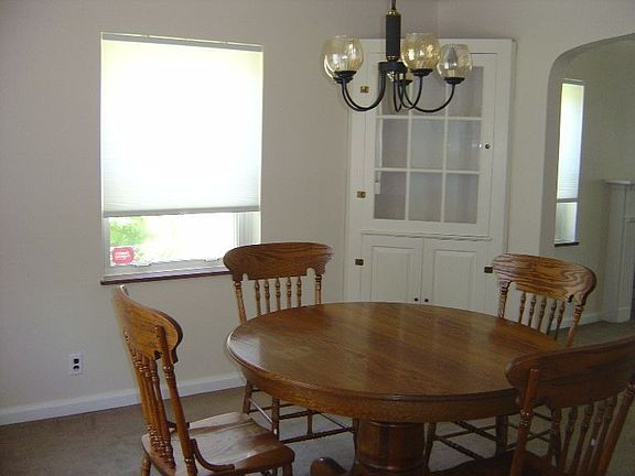 Formal dining room with built in corner cabinet