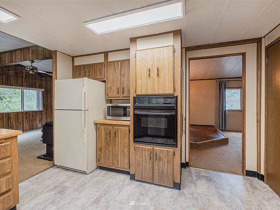 Another view of your kitchen showing the family room and dining room. 