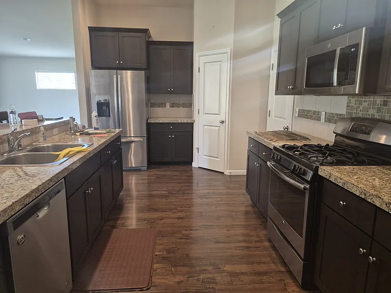 Kitchen also features dishwasher, coffee bar and double sink
