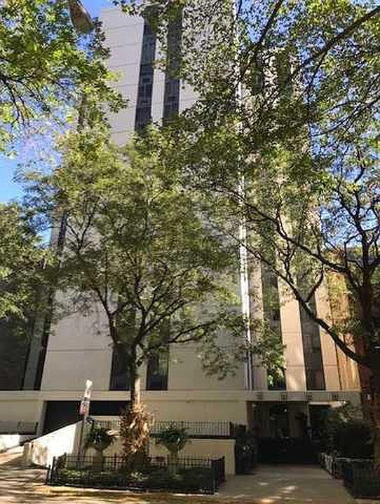 Professional managed building with tree-line street