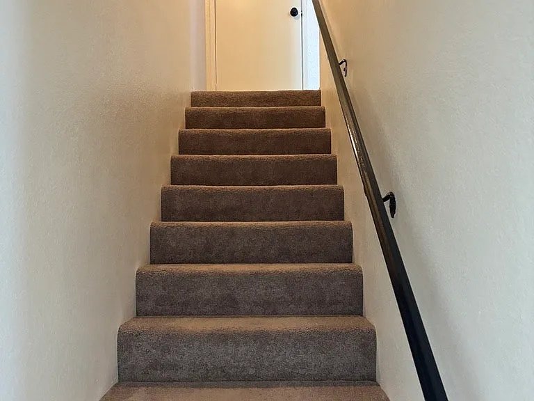 Stairs to bdrms & bath