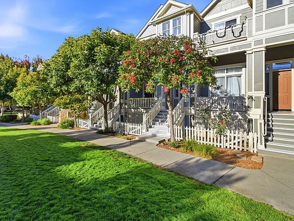 Exterior view showing the home's landscaped setting within Atherton Ranch.