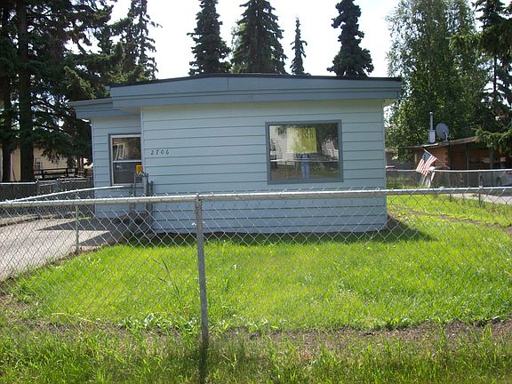 large fenced front yard