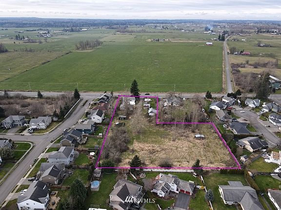 2.6 AC Sewer available two homes, outbuildings, barn pasture. >