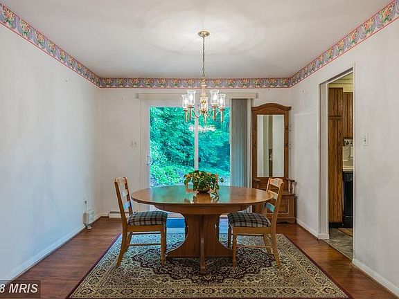 Dining Room looks out to wooded back yard