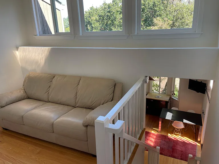 Home Office or Reading Room (left-side) with lots of window light. 
Stairs (right-side) back down to Studio/Kitchen.
