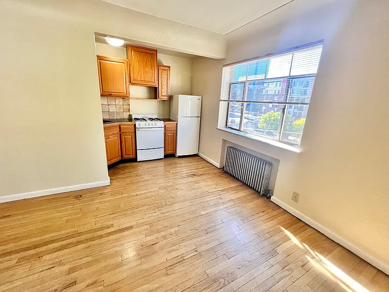 Step into this bright kitchen space featuring stylish wooden cabinetry and natural light. Step into this bright kitchen space featuring stylish wooden cabinetry and natural light.
