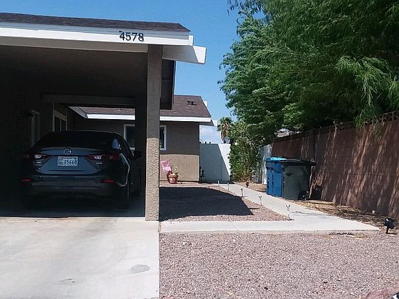 Front view covered parking and entrance walkway