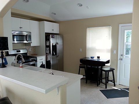 Kitchen with Tile and Bar