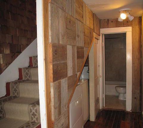 Entry facing laundry area, downstairs bath and stairs to 2nd level