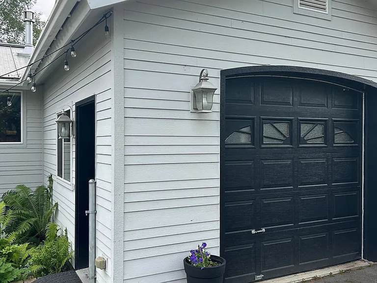 One car garage with lots of storage.
