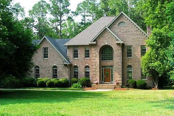 Gorgeous brick-front home on huge wooded, private lot!