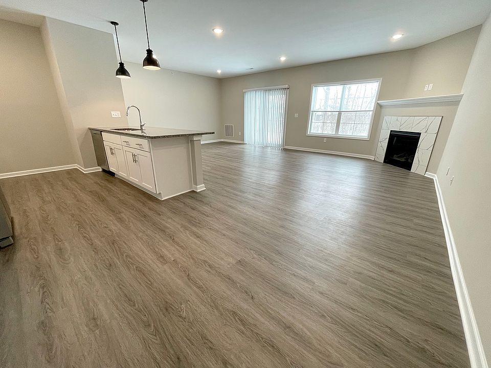 Open Concept Living Room and Kitchen with a Gas Fireplace