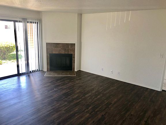 Living room with wood burning fireplace