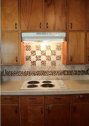 KITCHEN ALSO FEATURES UPDATED APPLIANCES, COUNTER-TOP & TRENDY GLASS/CERAMIC TILE BACKSPLASH